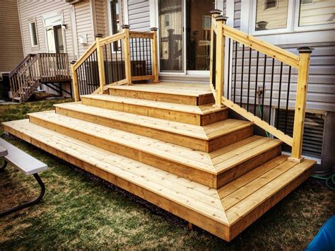 16" deep wrap around steps, will connect to ground level deck / pergola. Blocks view of a/c ...