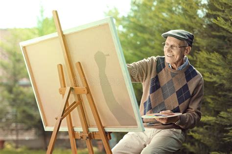 Elderly Man Painting on a Canvas Stock Photo - Image of paintbrush, retired: 101932082