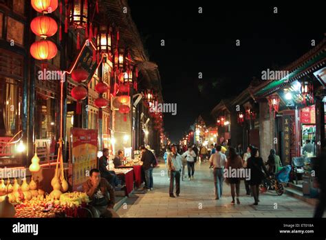 Bright night lights of the ancient Chinese city of Pingyao. China Stock ...