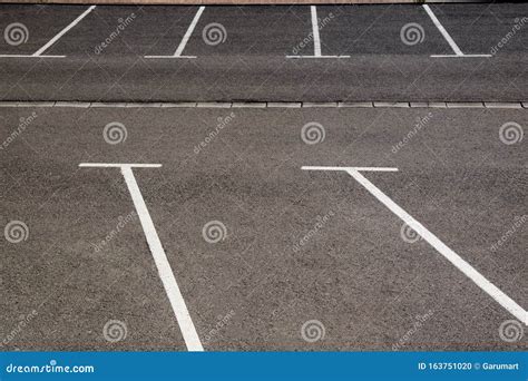 White Parking Lines On A Public Highway Royalty-Free Stock Image | CartoonDealer.com #163751020