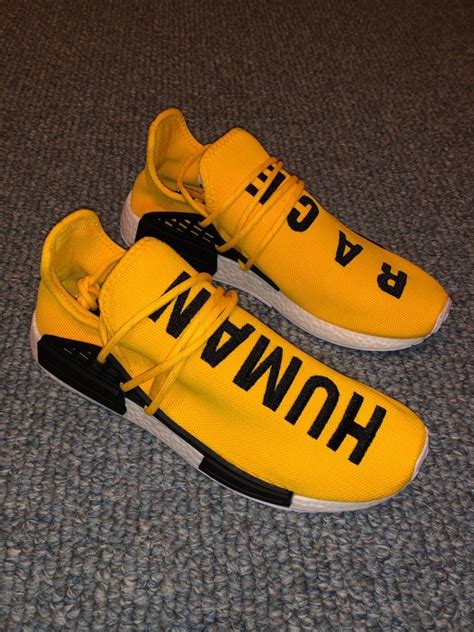 Like new size 10 Adidas NMD Human Race yellow sneakers. Shoes in great condition but do not ...