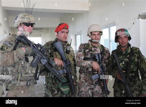 Coalition forces gather for a picture in a local schoolhouse Parwan ...