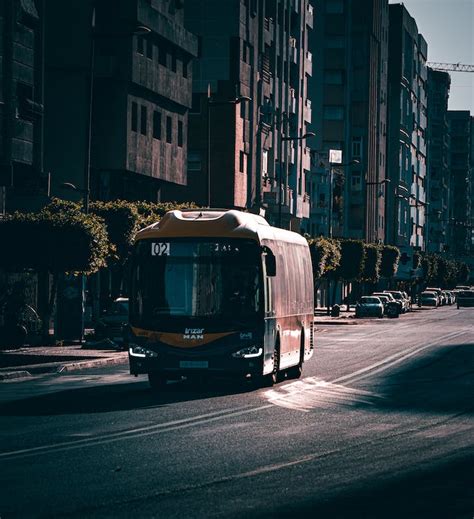 Bus Driving on City Road · Free Stock Photo