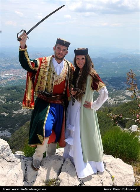 Traditional Montenegrin male and female costumes, with sword and ...