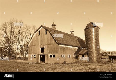 Sepia tint image of old dairy barn on a farm located in rural Illinois near Greenville Stock ...