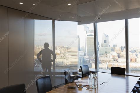 Silhouette businessman standing - Stock Image - F031/1866 - Science Photo Library