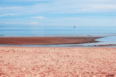 Premium Photo | Beach with blue sea.