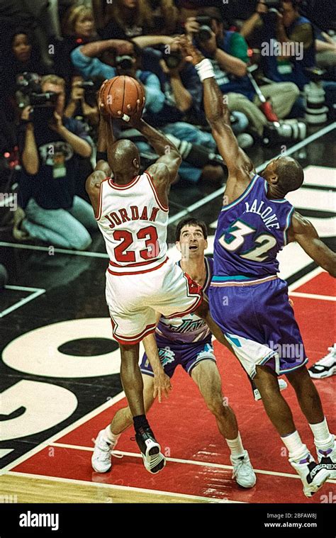 Michael Jordan competing against Karl Malone and John Stockton of the ...