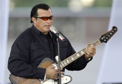 1364x768 resolution | Steven Seagal playing guitar while singing HD wallpaper | Wallpaper Flare