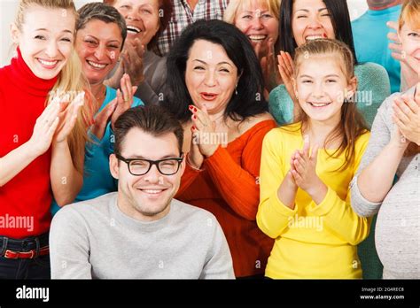 Large Group of Happy People smiling and clap their hands Stock Photo - Alamy