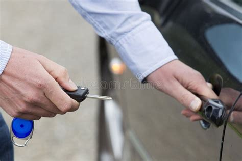 Man Unlocking Car Door. stock photo. Image of door, unlocking - 27052552