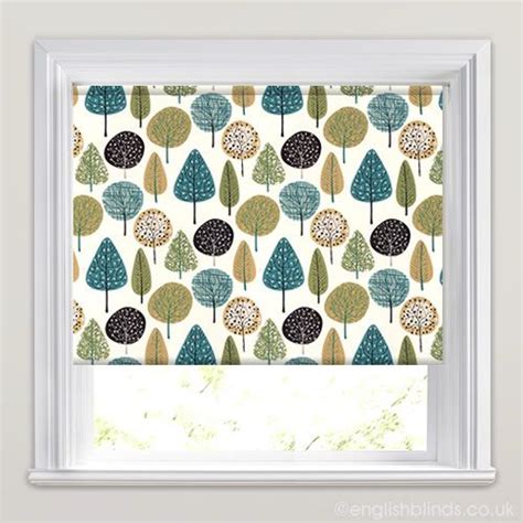 a window with trees printed on it and the blinds are closed to let light in