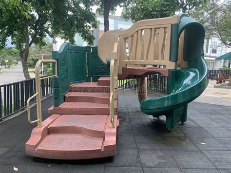 Playground in the Park with a Wooden Slide and a Swing Stock Image ...