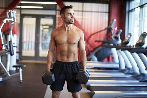 A man working out in the gym. stock photo