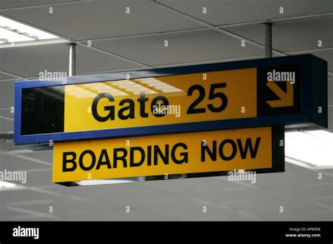 Gate 25 boarding now sign at Belfast International Airport northern Stock Photo: 5130986 - Alamy