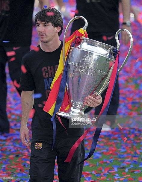 Barcelona's Argentinian forward Lionel Messi holds the UEFA Champions ...