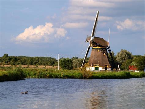 Windmill in Netherlands 2 stock image. Image of cloud - 23845063