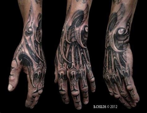 Gorgeous looking black ink detailed wrist and hand tattoo of alien like skeleton - Tattooimages.biz