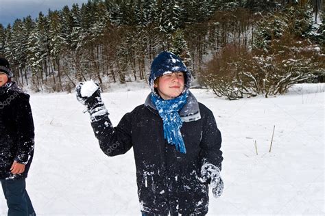 Children have a snowball fight in the white snowy area — Stock Photo © Hackman #5678963