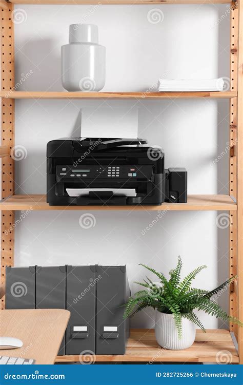 Modern Printer with Paper on Wooden Shelf in Home Office Stock Photo ...