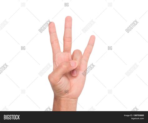 When doing the hand gesture for the number three, do you lift the thumb ...