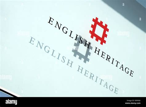 The English Heritage logo & text on a glass panel with shadow projected behind at their offices ...