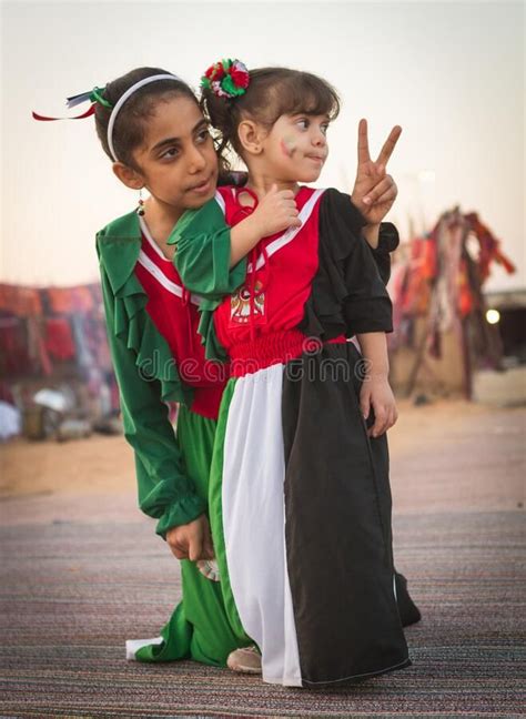 Two children wear national UAE dress. From Al Dafrah festival in ...