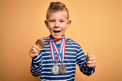 Young Little Caucasian Winner Kid Wearing Award Competition Medals Over ...