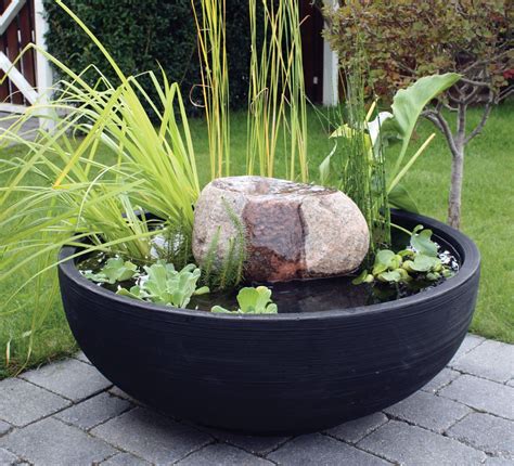 This stone drip fountain provides movement and sound in smaller water ...