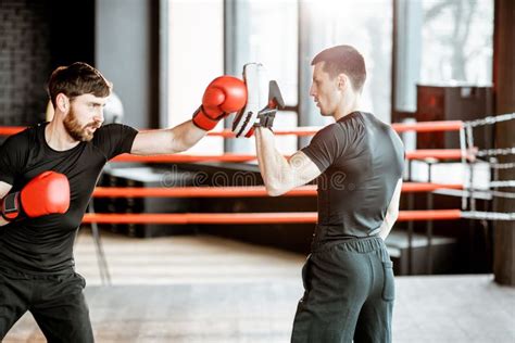 Man Training with Boxing Coach on the Boxing Ring Stock Photo - Image of teaching, gloves: 137600684