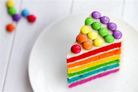 Slice of rainbow cake Stock Photo by ©RuthBlack 64989509