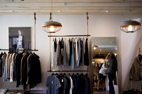 racks with mens apparel on the walls of a clothes store, store ...