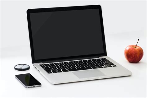 Macbook Pro Near Iphone and Apple Fruit · Free Stock Photo