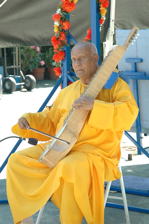 Playing esraj on “Aspiration-Ground”, 2004 – SRI CHINMOY PHOTOS