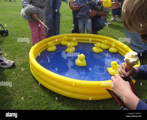 Hook the duck game at summer fete Suffolk England Stock Photo: 7906870 - Alamy