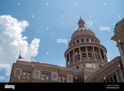 View of the Top of the Austin Capitol Building with Flag Half-Staff Stock Photo - Alamy