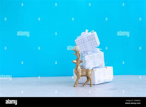 Christmas scene with golden deer Stock Photo - Alamy