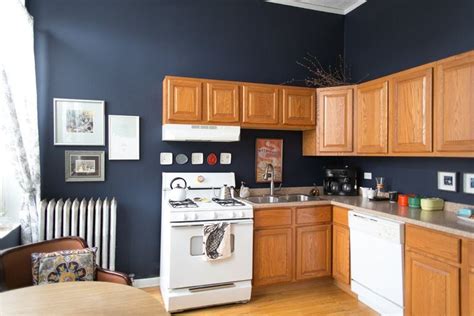 This Is How to Deal with Honey Oak Cabinets: Paint the Walls Midnight Blue | Blue kitchen walls ...