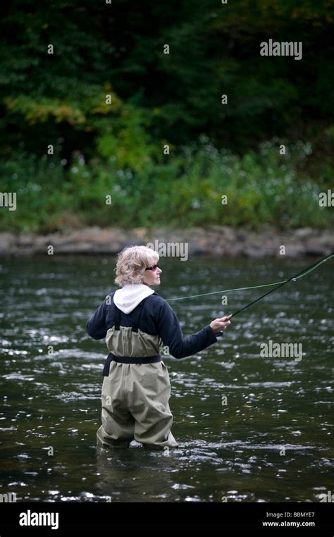 Woman Fly Fishing Stock Photo - Alamy