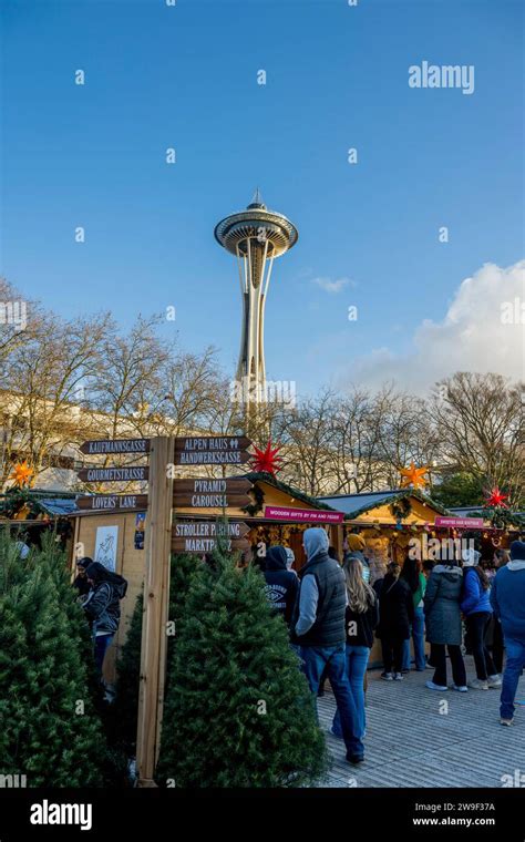 Seattle Christmas Market scene with vendors and the Space Needle at the Seattle Center in ...