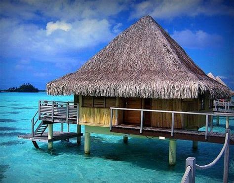 Bamboo tiki hut over the ocean, tropical vacation location | Best Travel Places, Vacation Spots ...