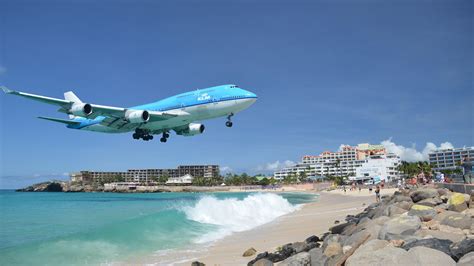 KLM Landing at Princess Juliana International Airport over Maho Beach, Sint Maarten - backiee