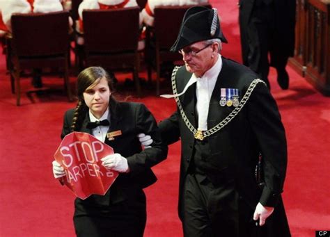 Sergeant-at-arms Kevin Vickers escorts a protester from the flo ...