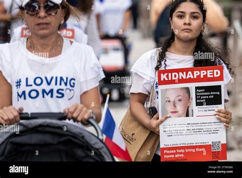 Surfside, Florida, USA. 5th Nov, 2023. A woman holds a poster of Agam ...