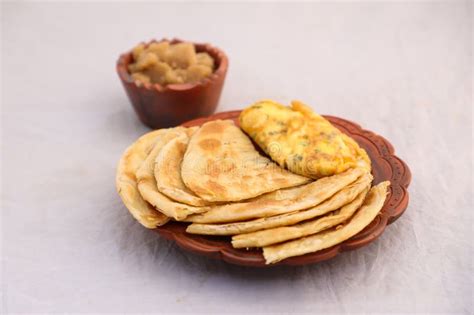 Desi Breakfast Omelet, Halwa and Paratha Served in Dish Isolated on Background Top View of ...