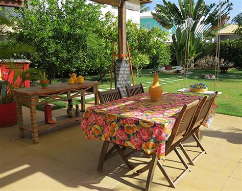 an outdoor dining area with table and chairs