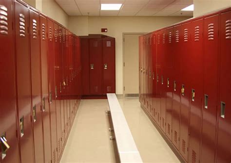 Download A Row Of Red Lockers In A Hallway | Wallpapers.com