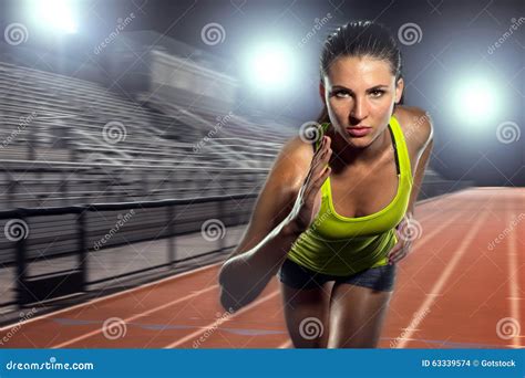 Female Runner Sprinter Exercising and Training Intense Track and Field Athlete Determination for ...