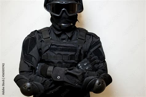 SWAT in black uniform, face mask and bulletproof vest. Russian special ...