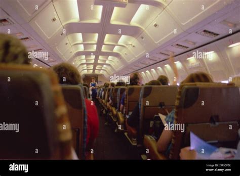 View of an aeroplane interior, with passengers, on a flight either to ...